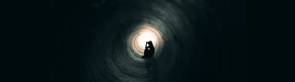 Woman in a dark place