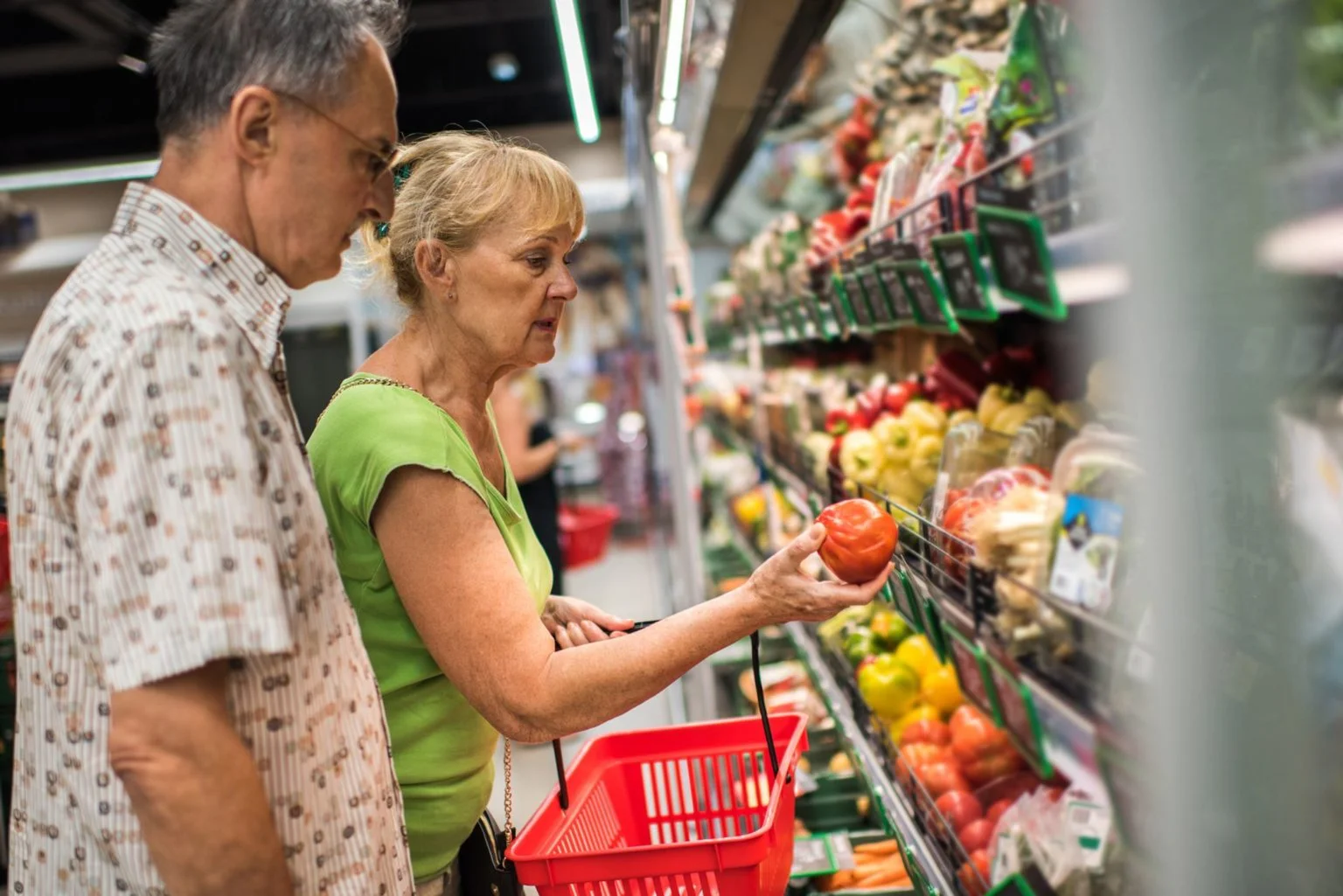 Older couple shopping at a grocery store