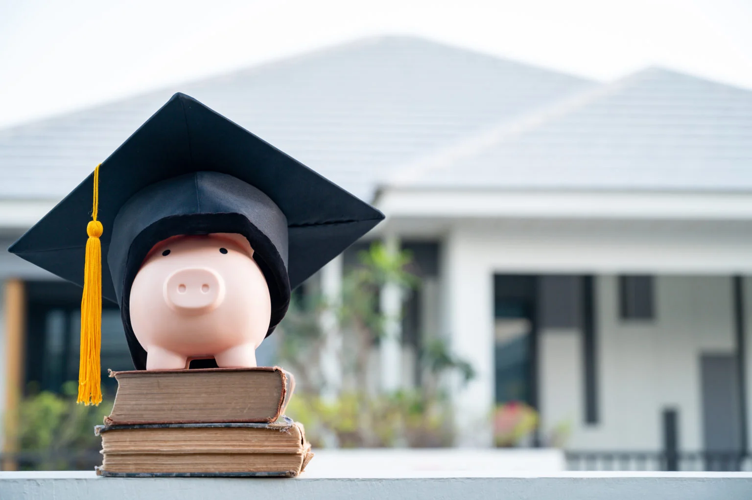 piggy bank and graduation cap University level. Concept of saving money for education.